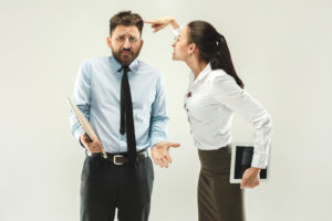 Angry boss. Woman and secretary standing at office or studio. Business man with his colleague. Female and male caucasian models. Office relationships concept, Human emotions